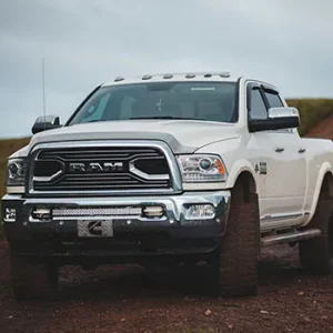 White pickup truck on dirt road
